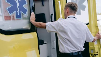 man opening the door of an ambulance